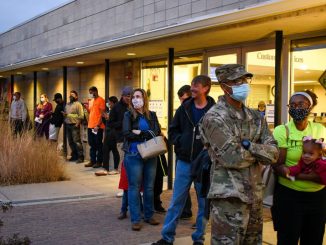 Voters standing outside a library in Fountain, Colorado