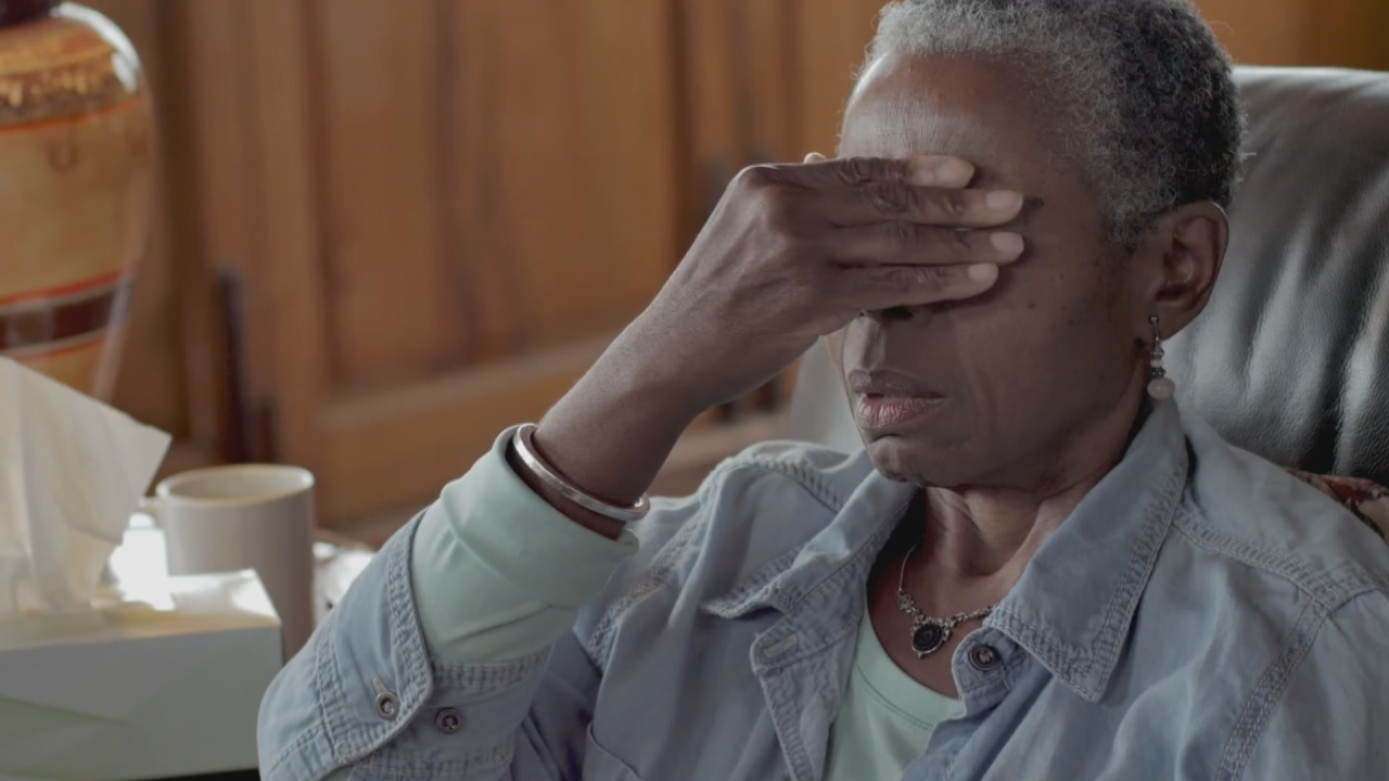 A person rubbing their eyes