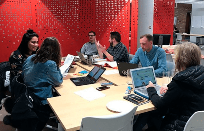 A team of people meeting in a conference room