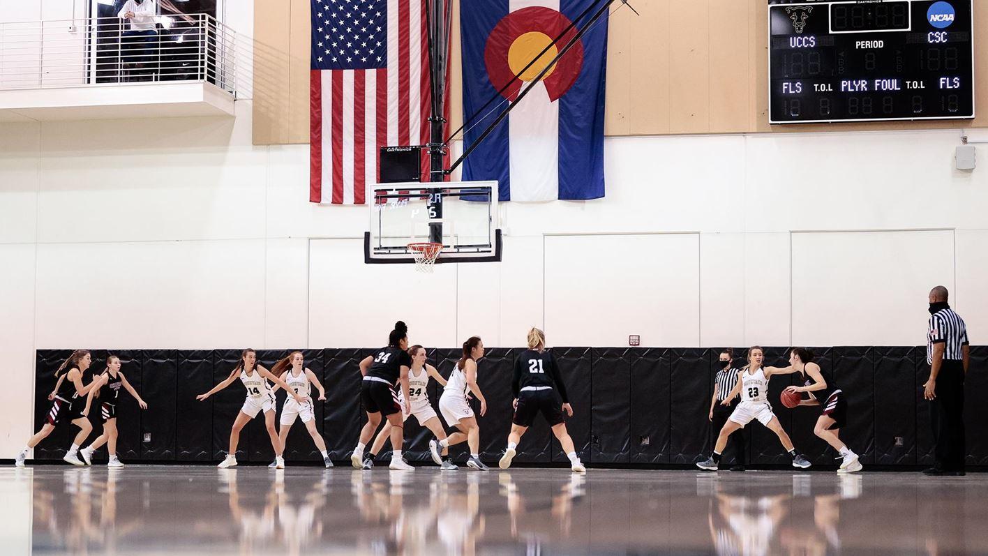 A wide angle of a women's basketball game at the Gallogly Events Center