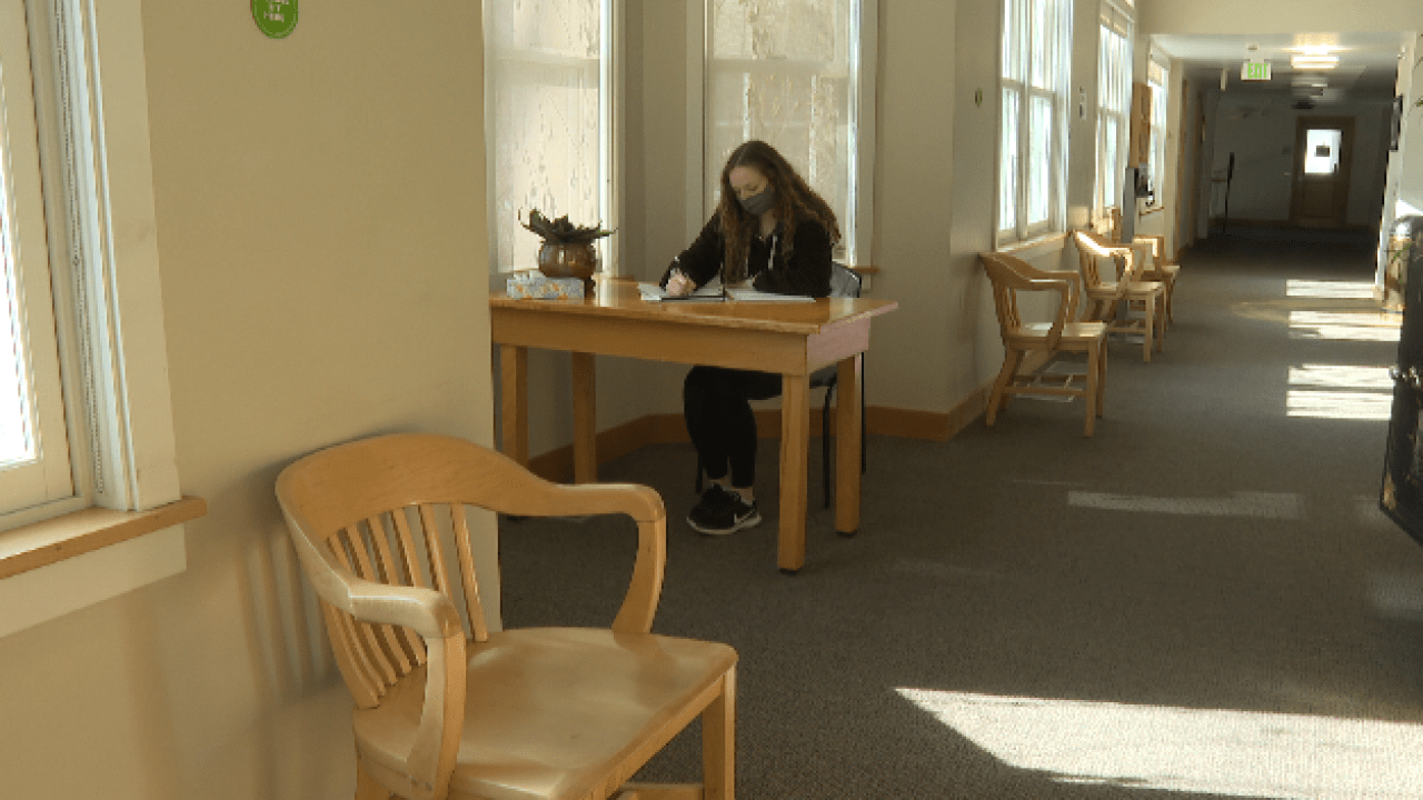 Maddy Saucerman working at a table in Main Hall