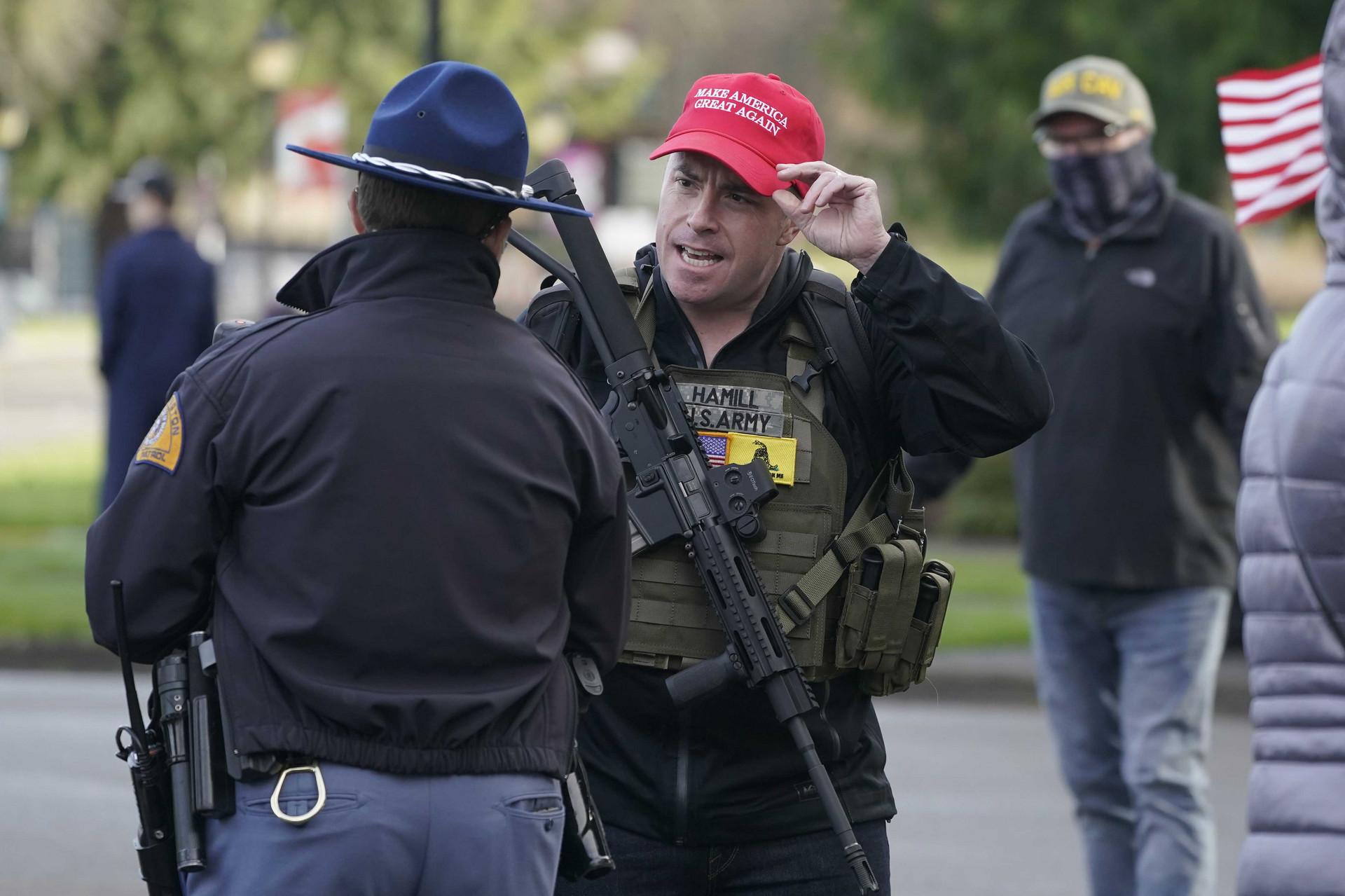 A protester confronts a law enforcement officer