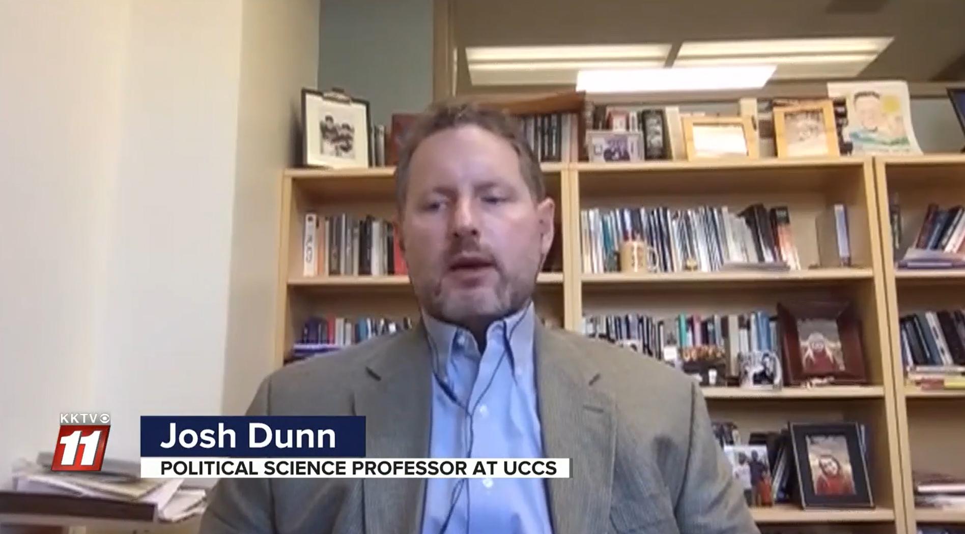 Screenshot of Josh Dunn being interviewed in his office by KKTV