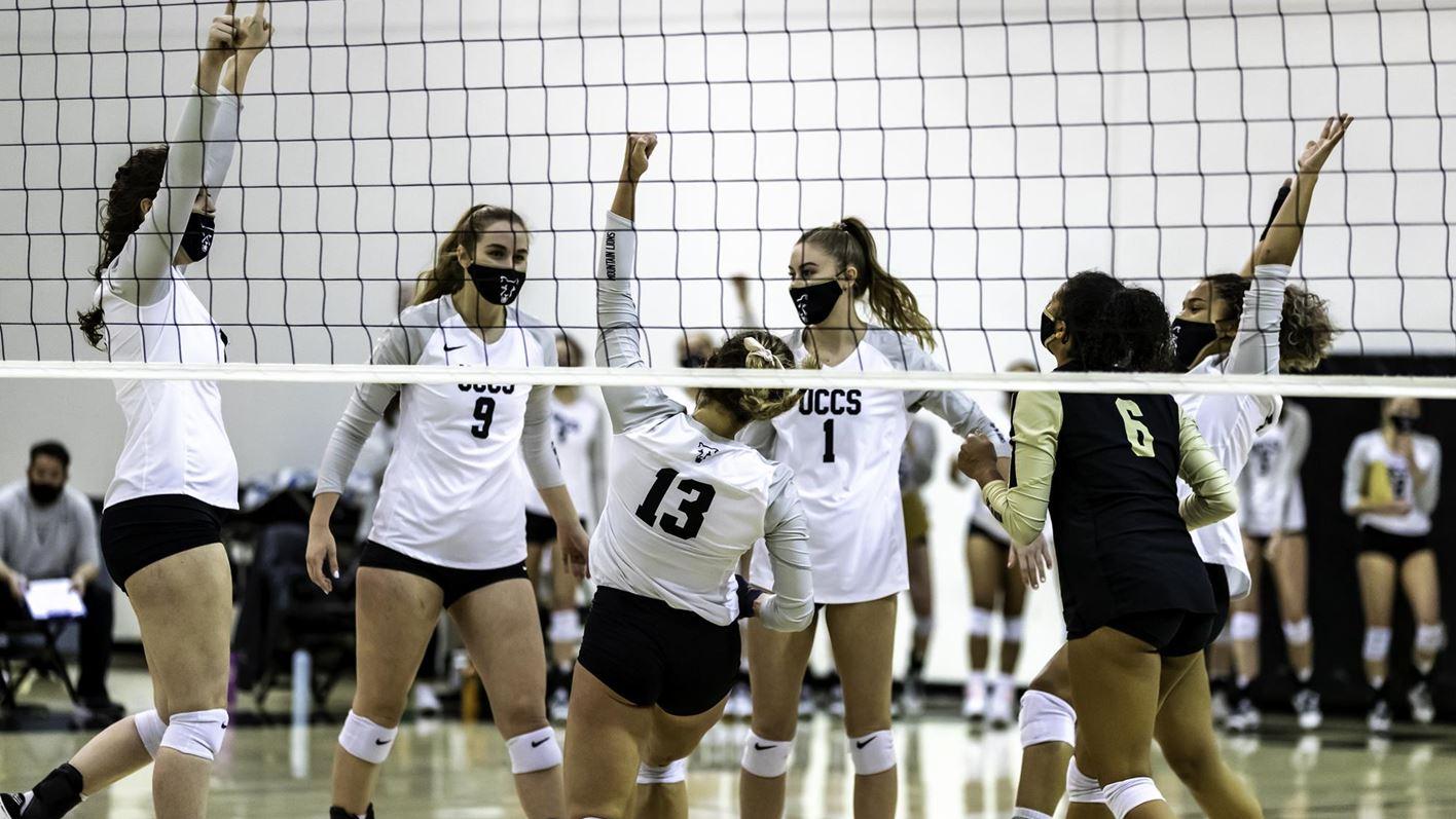 UCCS volleyball team celebrates after a point in the Gallogly Events Center