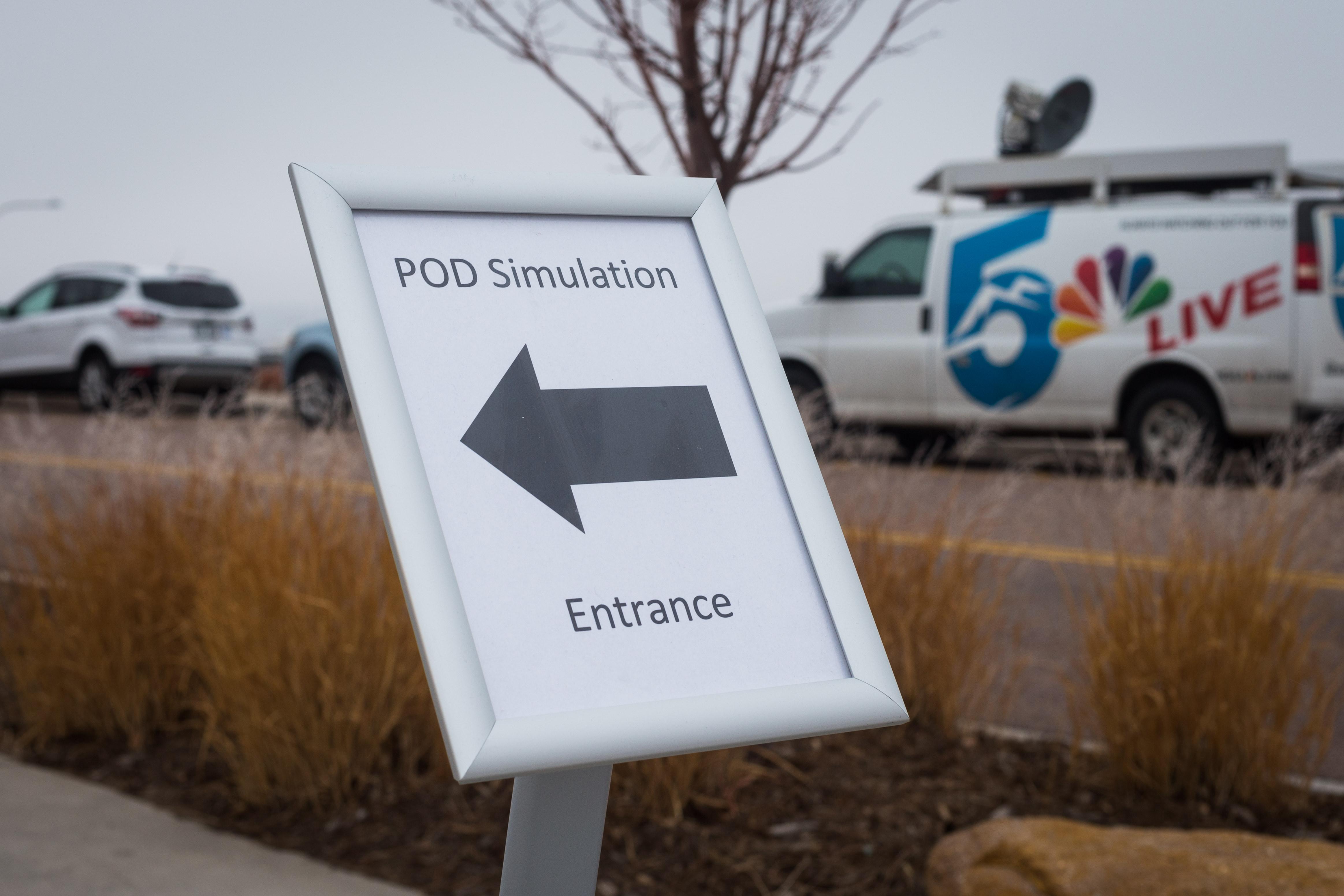 Sign that says "POD simulation entrance"