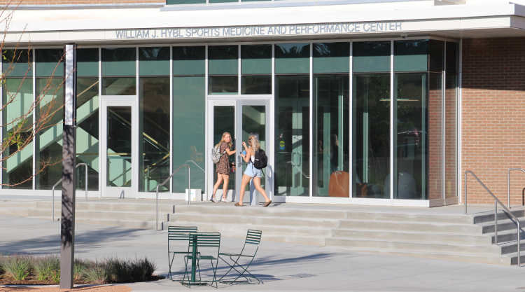 Two students enter the William J. Hybl Sports Medicine and Performance Center at UCCS on the first day of classes.