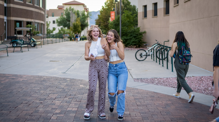 Two students show their excitement as the head toward Concert on the Lawn.